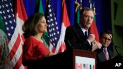 U.S. Trade Representative Robert Lighthizer, center, with Canadian Minister of Foreign Affairs Chrystia Freeland, left, and Mexico's Secretary of Economy Ildefonso Guajardo Villarrea, right, speaks during the conclusion of the fourth round of NAFTA negotiations in Washington, Oct. 17, 2017. 