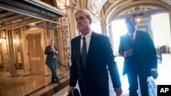 FILE - Special counsel Robert Mueller departs after a closed-door meeting with members of the Senate Judiciary Committee about Russian meddling in the election and possible connection to the Trump campaign, at the Capitol in Washington, June 21, 2017.