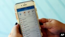 FILE - A call log is displayed via an AT&T app on a cellphone in Orlando, Fla., Aug. 1, 2017. Federal lawmakers reached an agreement on legislation to tackle robocalls.