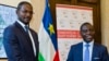 CAR Foreign Minister Charles Armel Doubane, right, and Armel Mingatoloum Sayo, head of the Revolution and Justice militia, mark the signing of a Central African Republic peace accord at the Sant'Egidio headquarters in Rome, June 19, 2017. Members of 13 Central African Republic's militant groups signed a preliminary agreement to stop the civil war, reaffirm the unity of the country, and the respect of human and civil rights.