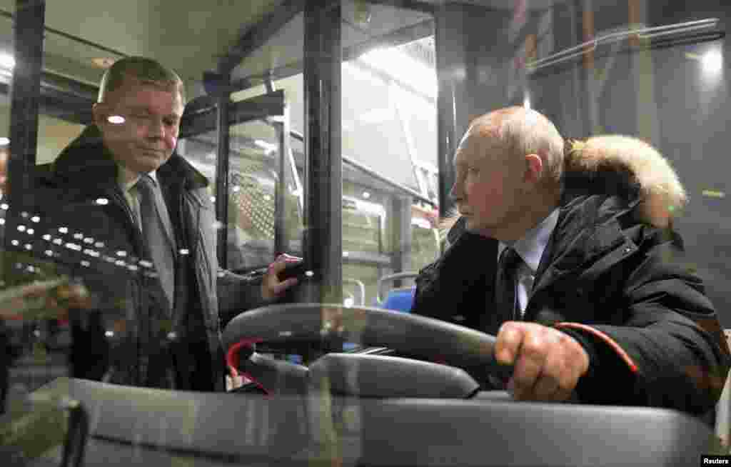 Russian President Vladimir Putin visits the Ural Locomotives plant in the town of Verkhnyaya Pyshma in the Sverdlovsk Region, Russia, Feb. 15, 2024. (Sputnik/Aleksey Nikolskyi/Kremlin via Reuters)