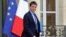 French Prime Minister Manuel Valls leaves a meeting with members of the government at the Elysee Palace in Paris, May 26, 2014.