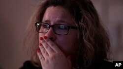 Angelica Magana, 34, a Dreamer, who was brought to the United State at the age of eight, reacts to President Donald Trump as he lays out is immigration policy during a State of the Union watch party in Chicago, Jan. 30, 2018.