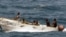 U.S. Navy photo: pirates leave the Ukrainian merchant vessel MV Faina for Somalia's shore, October 2008.