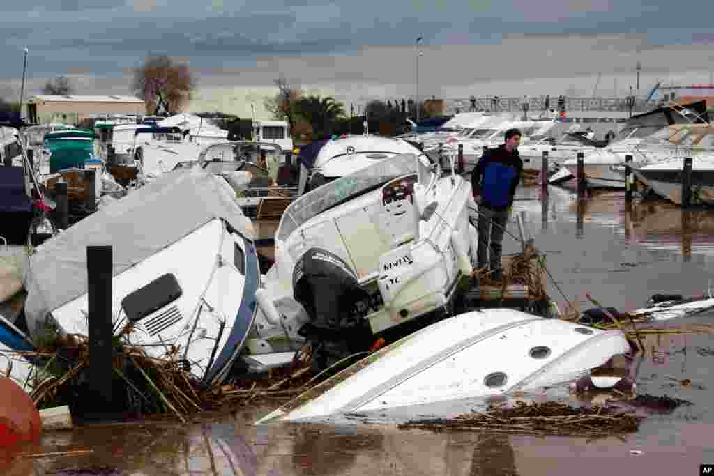 Motor boats sunk in the port of La Londe Les Maures, near Toulon, southern France after unusually heavy rains flooded the French Riviera, leaving two people dead and some thousands without electricity or access to roads. 