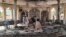 People view the damage inside of a mosque following a bombing in the provincial capital of Kunduz, northern Afghanistan, Oct. 8, 2021.