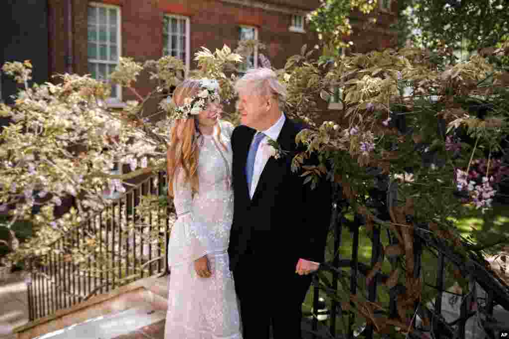 British Prime Minister Boris Johnson and his wife Carrie Johnson are seen in the garden of 10 Downing Street after their wedding in London, May 29, 2021.