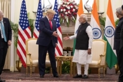 U.S. President Donald Trump and Indian Prime Minister Narendra Modi shake hands before their meeting at Hyderabad House, Feb. 25, 2020, in New Delhi, India.