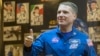 FILE - American astronaut Terry Virts, a member of the International Space Station crew, gives a thumbs up during a news conference behind a glass wall at Baikonur cosmodrome, Nov. 22, 2014. 