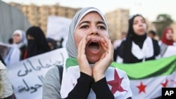 Women take part in a demonstration against Syria's President Bashar al-Assad. (file)