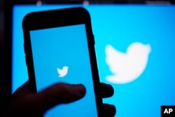 FILE - The Twitter application is seen on a digital device on April 25, 2022, in San Diego. (AP Photo/Gregory Bull, File)