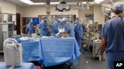 Doctors perform surgery at St. Vincent Infirmary Medical Center, Little Rock, Ark., undated file photo.