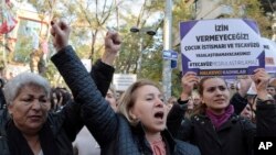 Turkish women stage a protest in Ankara, Turkey, Nov. 19, 2016, after a debate flared in Turkey after a government proposal which would pardon some people imprisoned for statutory rape, fell short of passage by legislators. 