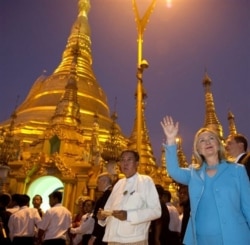 FILE - Then-U.S. Secretary of State Hillary Clinton tours Shwedegon Pagoda, a Buddhist temple founded between the 6th and 10th centuries AD, in Yangon, Myanmar, Dec. 1, 2011.