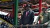 FILE - South Sudan's President Salva Kiir, center, accompanied by army chief of staff Paul Malong Awan, right, attends an independence day ceremony in the capital Juba, South Sudan, July 9, 2015.