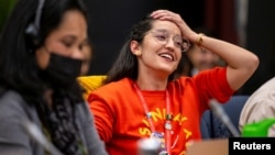 A member of Mexico's delegation reacts after The Kunming-Montreal Global Biodiversity Framework was passed, in Montreal, Canada, Dec. 19, 2022.