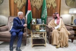 FILE - A handout picture provided by the Palestinian Authority's press office (PPO) Oct. 17, 2019, shows Saudi Crown Prince Mohammed bin Salman (R) meeting with Palestinian Authority President Mahmoud Abbas, in the Saudi capital Riyadh.