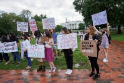 People rally in Lafayette Park in support of the Afghan people near the White House in Washington, Aug. 21, 2021.