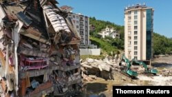 A partially collapsed building in area was hit by flash floods that swept through towns in the Turkish Black Sea region, in the town of Bozkurt, in Kastamonu province, Turkey, August 14, 2021.