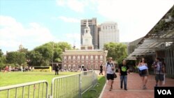 People walk along the Independence Hall, the historic place in Philadelphia, Pennsylvania. July, 27 2016.