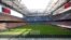 FILE - A view of the empty San Siro stadium during the Serie A soccer match between AC Milan and Genoa, in Milan, Italy, March 8, 2020. 