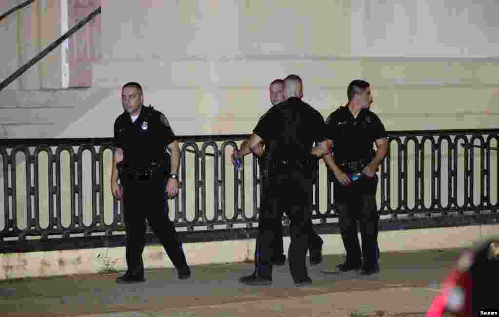 Police respond to a shooting at the Emanuel AME Church in Charleston, South Carolina, June 17, 2015. A gunman opened fire on Wednesday evening at the historic African-American church in downtown Charleston. REUTERS/Randall Hill - RTX1GZX6