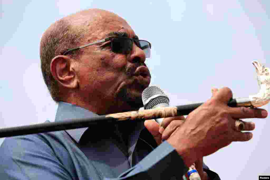 FILE - Sudan's President Omar al-Bashir addresses supporters during his visit to the war-torn Darfur region, in Bilal, Darfur, Sudan Sept. 22, 2017. 