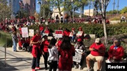 Teachers gather at Grand Park in Los Angeles for a rally after their union reached a deal with school district officials on a new proposed contract in Los Angeles, California, Jan. 22, 2019.