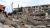 Rescue workers are seen at the scene of a traffic police station and lodging quarters attacked with a car bomb by Kurdish rebels, in Nusaybin, southeastern Turkey, March 4, 2016.