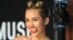 Miley Cyrus arrives at the MTV Video Music Awards on Aug. 25, 2013, at the Barclays Center in the Brooklyn borough of New York. 