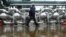 An employee walks through the Slavneft-YANOS refinery in the city of Yaroslavl, about 250 kilometers northeast of Moscow, October 25, 2012.