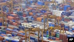 Containers are seen in a port in Singapore. 