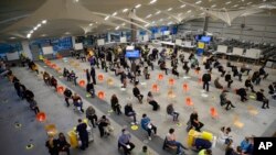 A general view of the interior of a converted call center, which is being used as an NHS COVID-19 vaccination center in Ramsgate, England, Dec. 16, 2021.