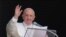 FILE - Pope Francis waves to the crowd as he arrives to recite the Angelus noon prayer from the window of his studio overlooking St.Peter's Square, at the Vatican.