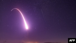 This U.S. Air Force handout photo shows an unarmed Minuteman III intercontinental ballistic missile launching during an operational test at 1:13 a.m. Pacific Time, at Vandenberg Air Force Base, California.