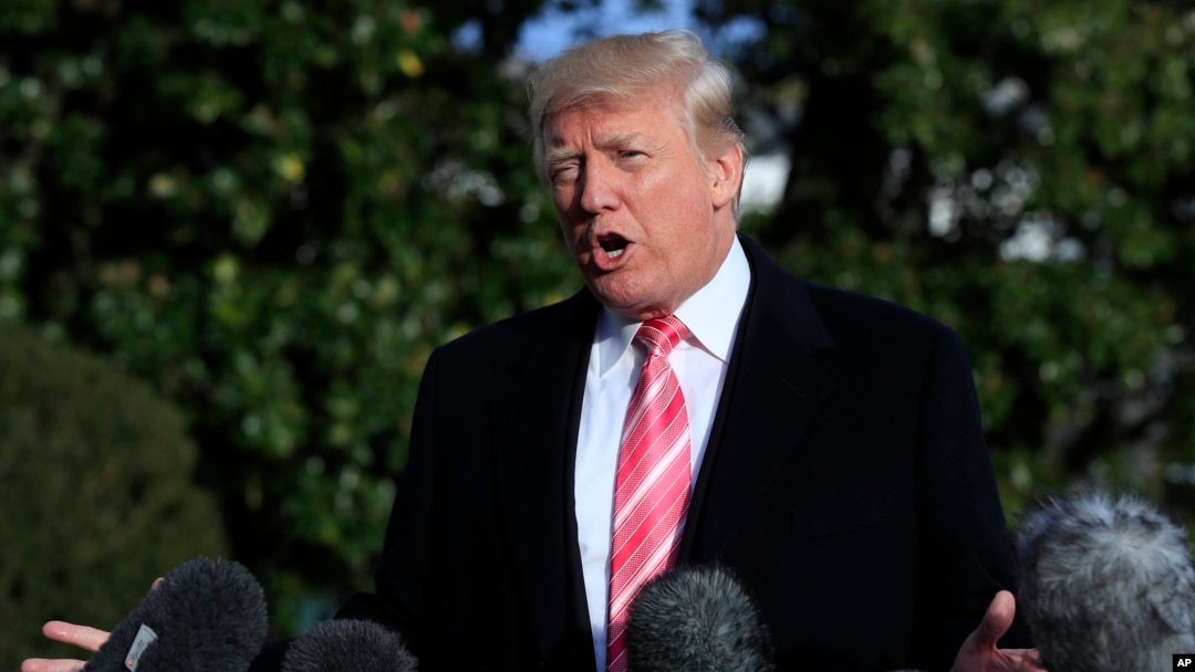 President Donald Trump speaks to reporters before leaving the White House, Nov. 21, 2017, in Washington, for a Thanksgiving trip to Mar-a-Lago estate in Palm Beach, Fla. Trump all but endorsed embattled Alabama Republican Senate candidate Roy Moore.