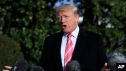 President Donald Trump speaks to reporters before leaving the White House, Nov. 21, 2017, in Washington, for a Thanksgiving trip to Mar-a-Lago estate in Palm Beach, Fla. Trump all but endorsed embattled Alabama Republican Senate candidate Roy Moore.