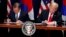 President Donald Trump, right, and South Korean President Moon Jae-In participate in a signing ceremony for the United States-Korea Free Trade Agreement at the Lotte New York Palace hotel during the U.N. General Assembly, Sept. 24, 2018.