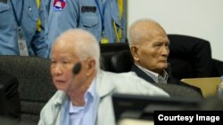 FILE - Khieu Samphan and Nuon Chea in a 2013 hearing at the Khmer Rouge tribunal. (Courtesy Image of Mark Peters/ECCC)