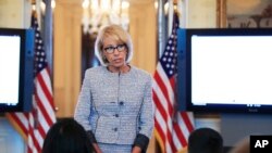 FILE - U.S. Education Secretary Betsy DeVos speaks during a discussion on educational issues, in the Blue Room of the White House in Washington, April 9, 2018. 