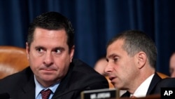 FILE - Rep. Devin Nunes talks to Steve Castor, Republican staff attorney for the House Oversight Committee, during testimony from former U.S. Ambassador to Ukraine Marie Yovanovitch at the House Intelligence Committee on Capitol Hill, Nov. 15, 2019.