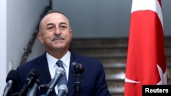 FILE PHOTO: Turkish Foreign Minister Cavusoglu attends a news conference with his Lebanese counterpart in Beirut