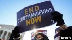 Demonstrators protest during a Fair Maps rally outside the U.S. Supreme Court, in Washington, March 26, 2019.