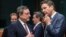 Dutch Finance Minister Jeroen Dijsselbloem, right, talks with European Central Bank Governor Mario Draghi during a meeting of eurogroup finance ministers at the European Council building in Brussels, March 9, 2015. 