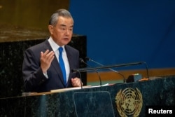 Foreign Minister of the People's Republic of China Wang Yi addresses the 'Summit of the Future' in the General Assembly hall at United Nations headquarters in New York City, Sept. 23, 2024.