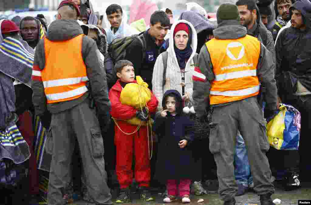 Migrants wait for buses in Nickelsdorf, Austria.