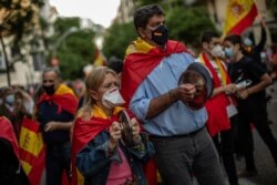People take part in a protest against the Spanish government amid the lockdown to prevent the spread of coronavirus in Madrid, Spain, May 18, 2020.
