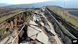 FILE: Cracks along the road near Koseli village in Pazarcik, Kahramanmaras, southern Turkey, Sunday, Feb. 12, 2023 following last week's earthquake