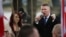 FILE - Paul Golding (R) and Jayda Fransen (L), leaders of the far-right organisation Britain First, talk during a march in central London on April 1, 2017.