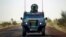 French soldiers in a British made armored car lead a French supply convoy near Hambori, northern Mali, on the road to Gao, February 4, 2013.